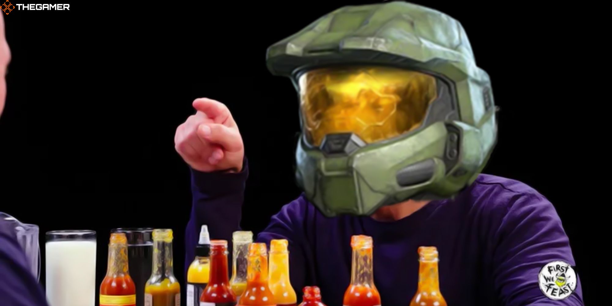 The Master Chief points at Sean Evans while struggling to handle spicy wings on the YouTube show Hot Ones. Custom image for TG.