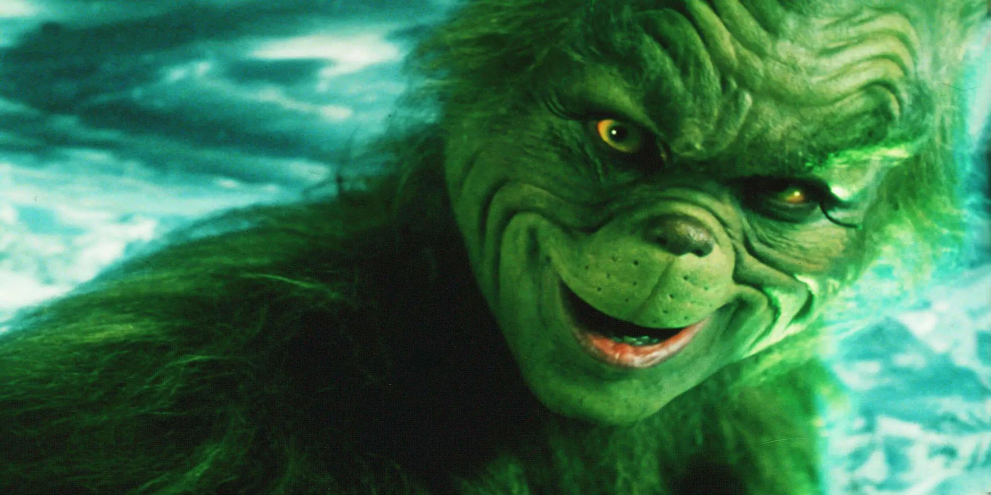 Jim Carrey gives a sinister look to the camera in the iconic motion picture, How the Grinch Stole Christmas (2000).