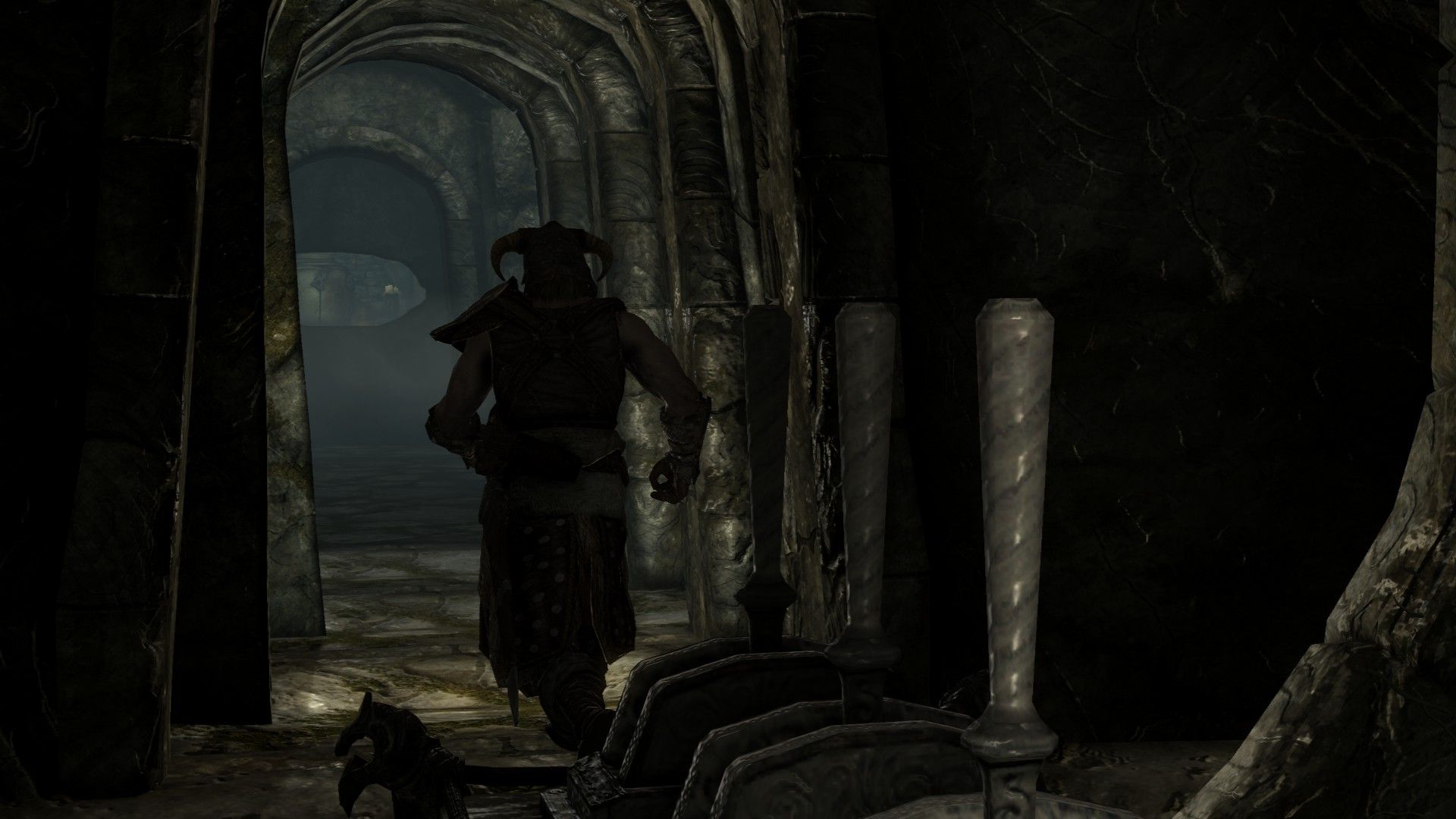 A man runs through a hallway with a trio of levers in the foreground.