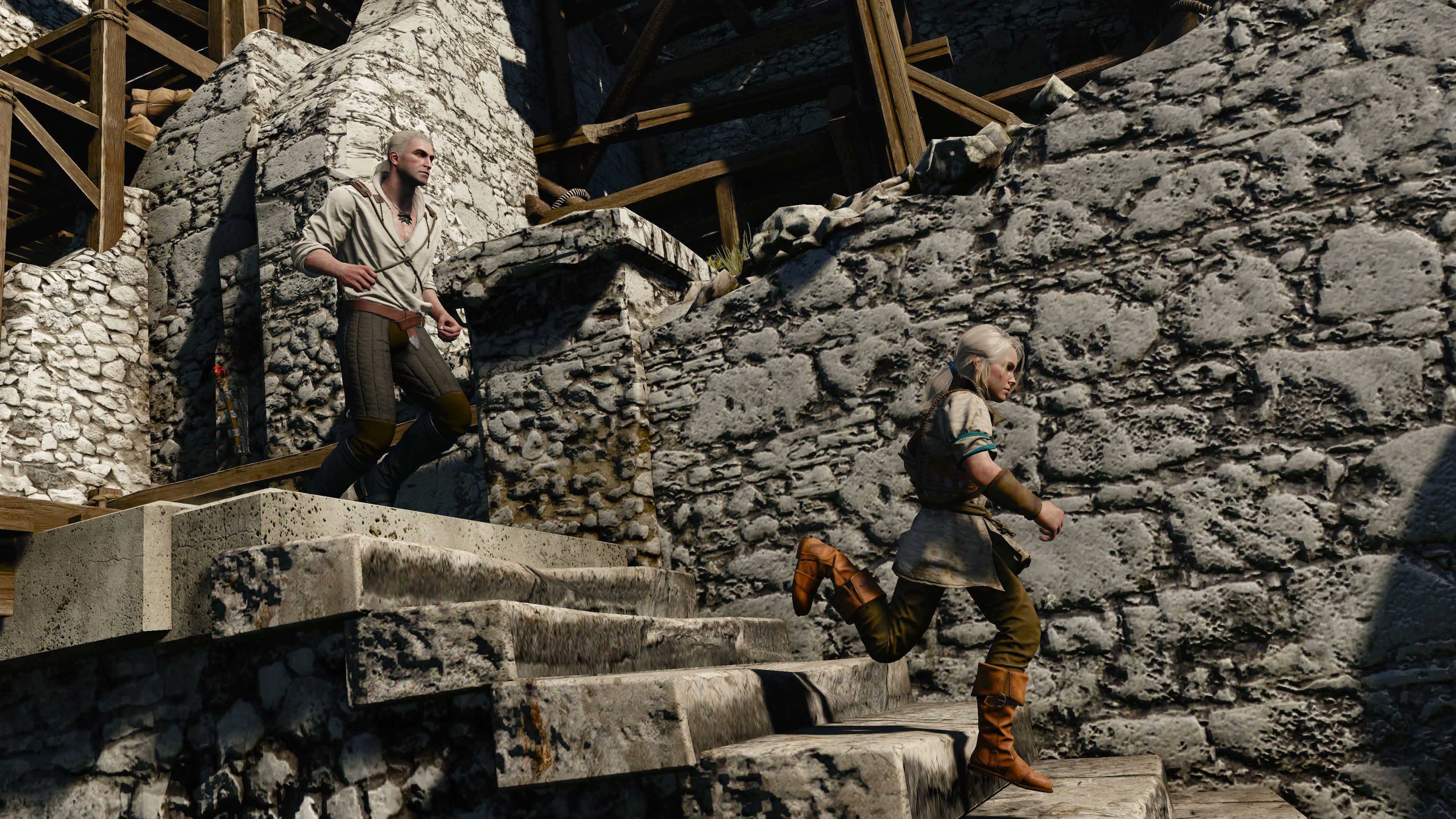 A young girl runs down a flight of stairs in a crumbling castle with a man in close pursuit.