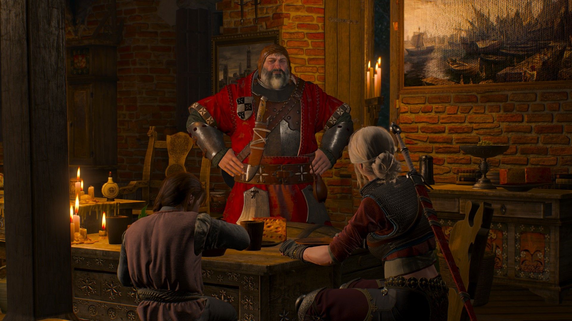 A man dressed in red armor speaks to a pair of girls at his dining table, hands on his hips.