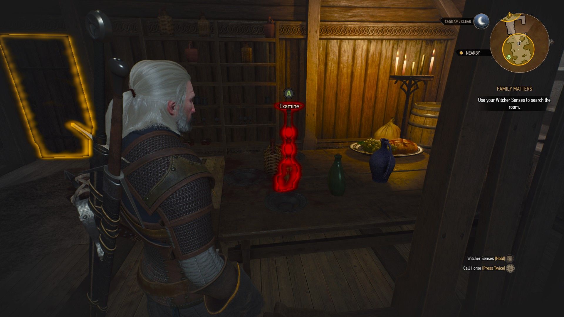 A screenshot of the game, showing a broken candlestick glowing red with a prompt to investigate floating above it.