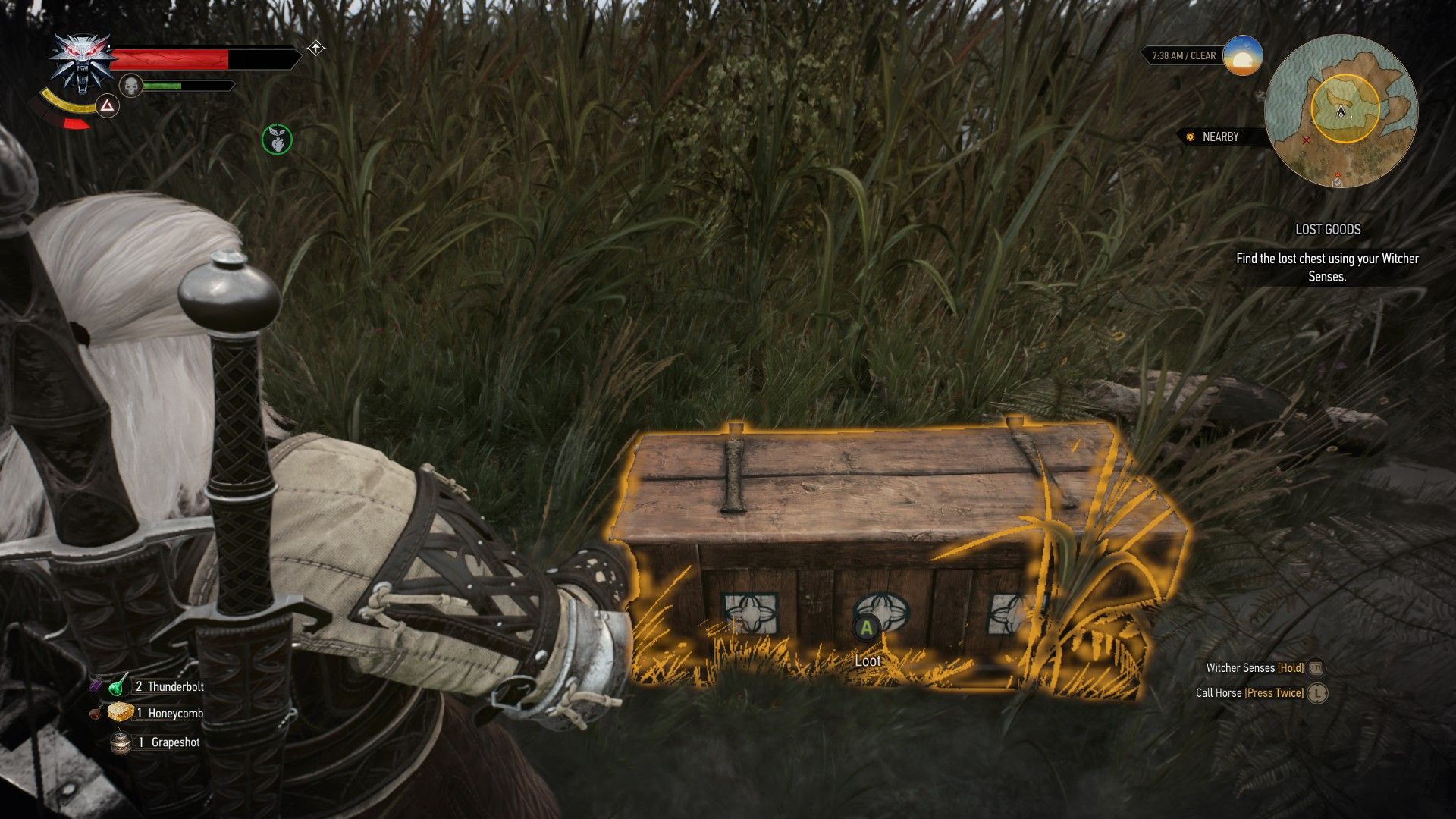 A screenshot of a treasure chest highlighted with Geralt's Witcher Senses in a marsh.