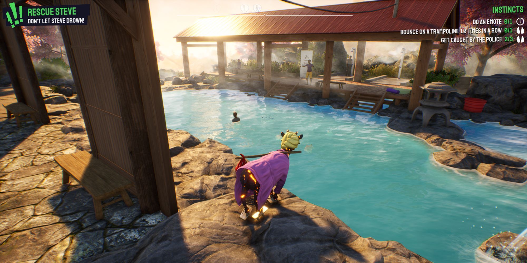 Pilgor stands on some rocks overlooking some hot springs with a guy and some fish in the water