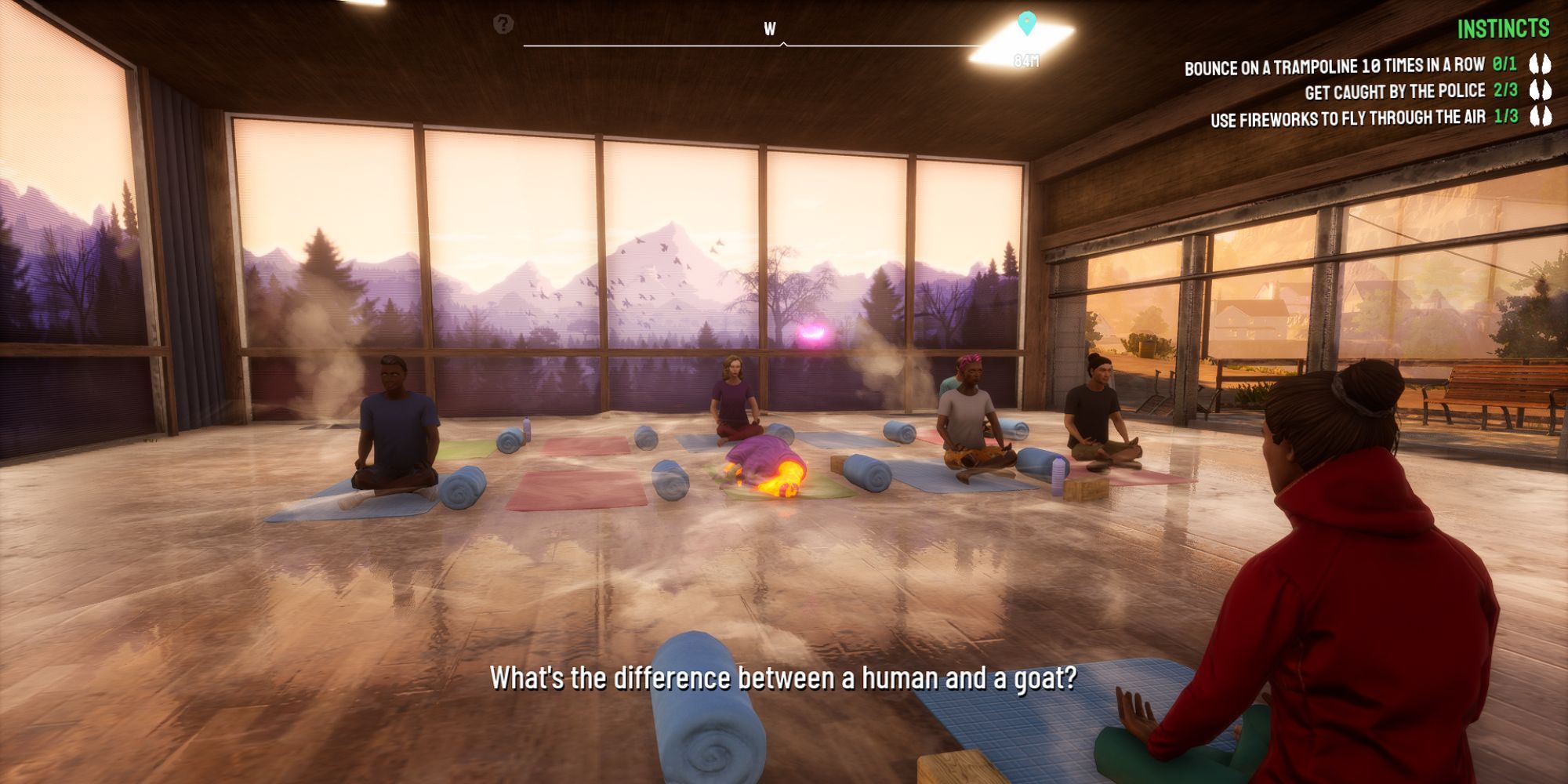 the yoga instructor speaks to the class about the difference between a human and a goat, withe everyone sitting on their mats as pilgor lies ragdoll on her own mat
