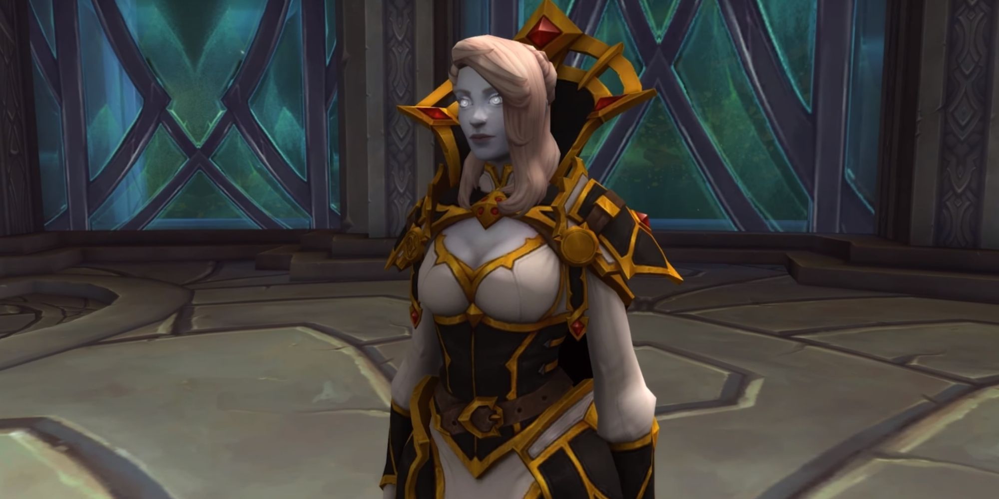 An image of Calia Menethil standing inside a room, wearing black and gold armor.