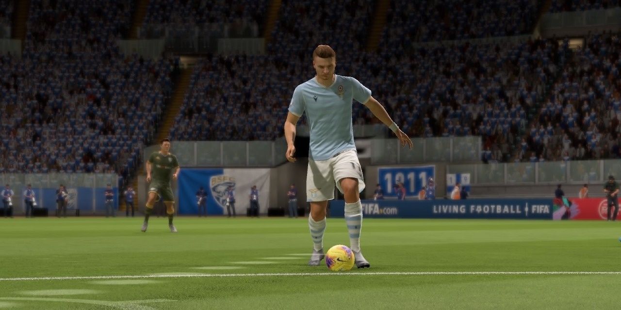 Ciro Immobile dribbling a yellow ball during a match in FIFA