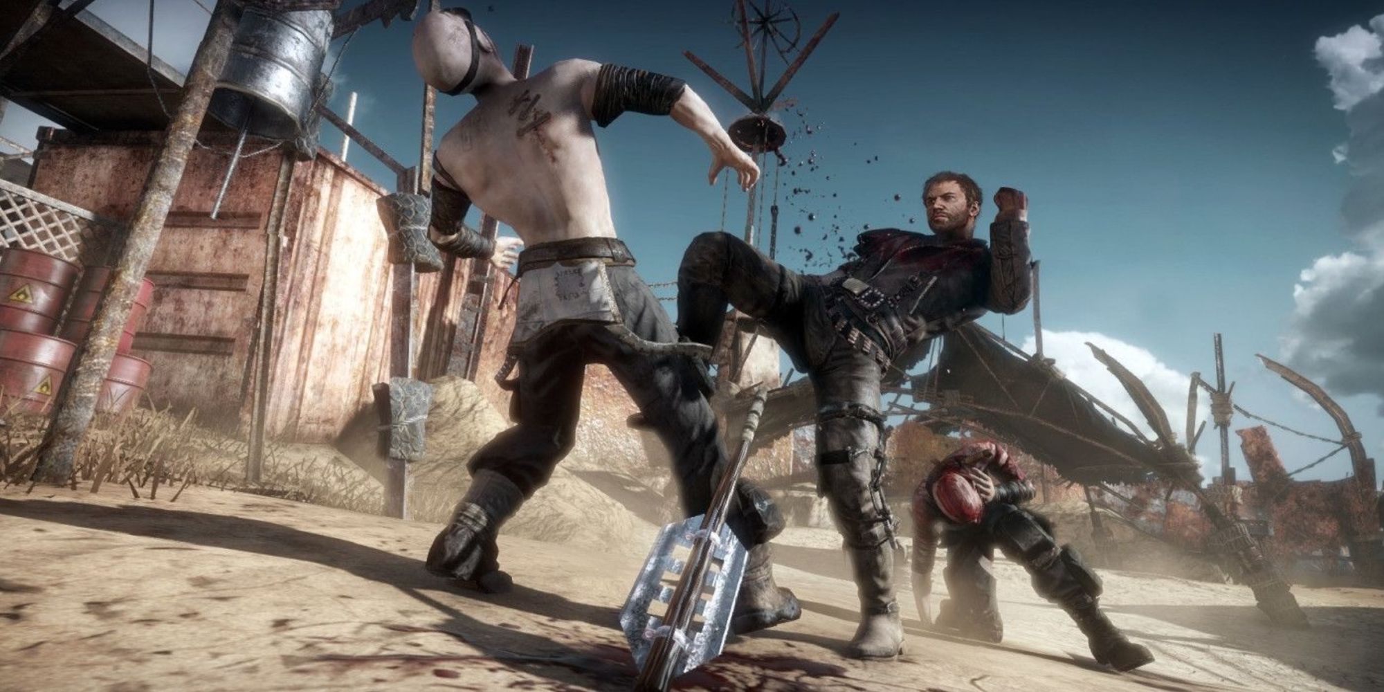 A cinematic image of Mad Max kneeing a War Boy in the face, causing his weapon to drop. And another enemy is already kneeling behind Max.