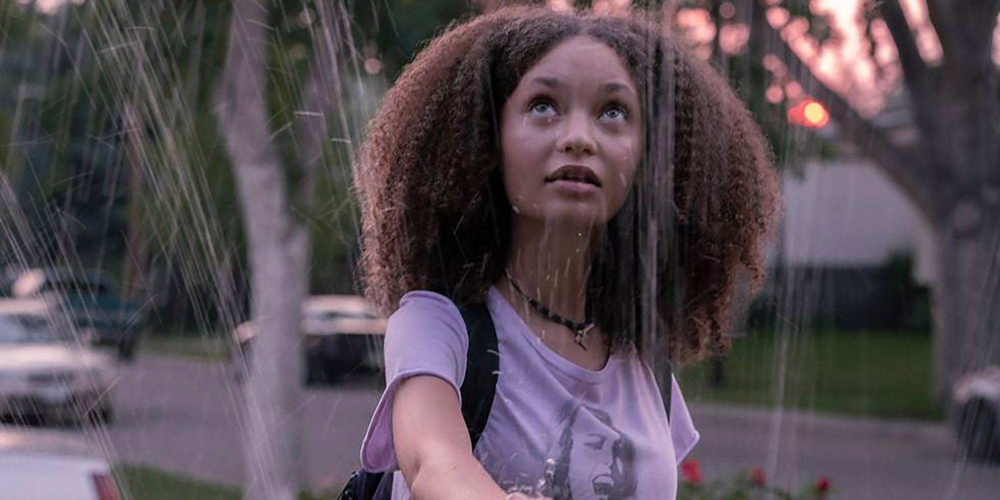 sarah touching a sprinkler in the last of us