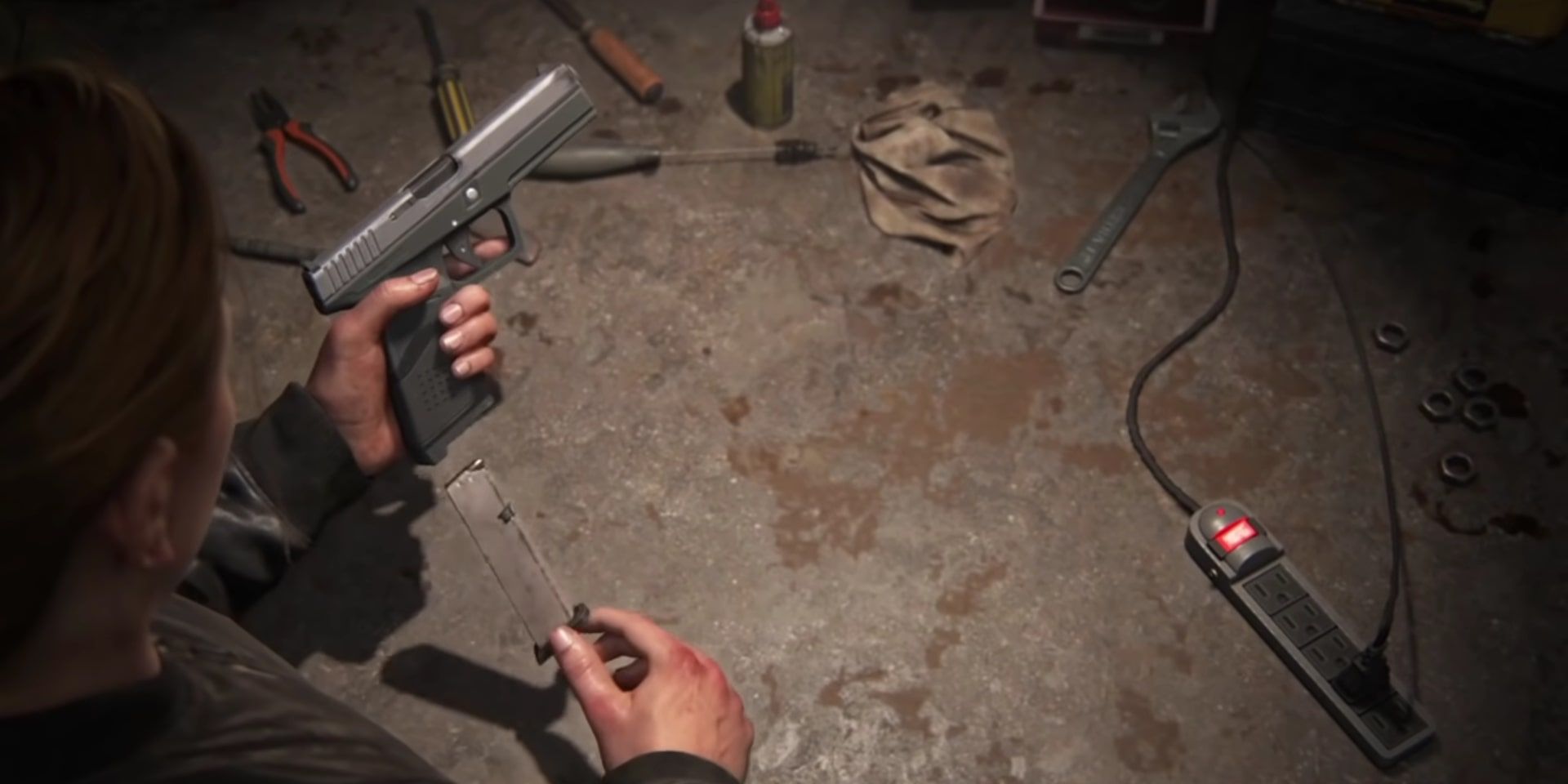 Abby disassembling her gun to make some upgrades at a bench in The Last of Us Part 2. 