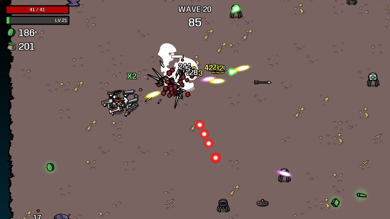 The player has multiple ranged weapons and attacks a boss in Brotato.
