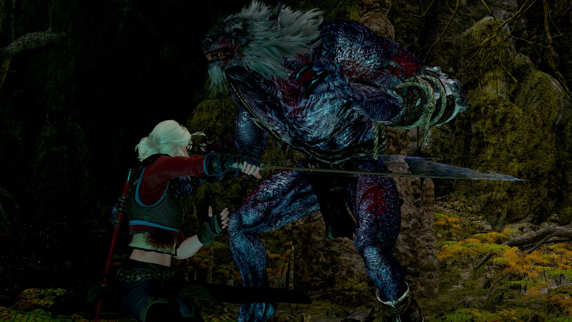 Ciri slashes at a monster inside a dark cave.