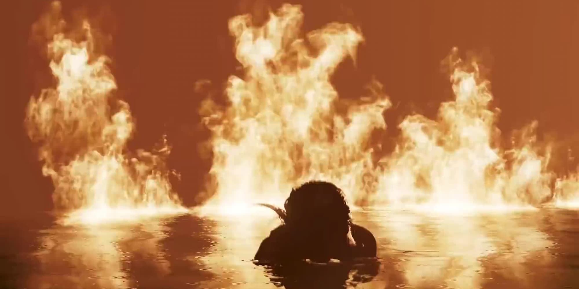Lara Croft emerges from a body of water with a fire raging behind her.