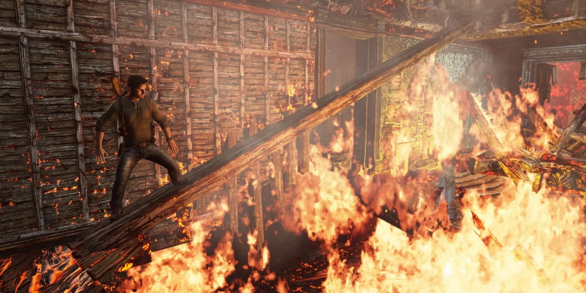 Nathan Drake stands on a titled wooden beam as fire tears apart a building around him in Uncharted 3.
