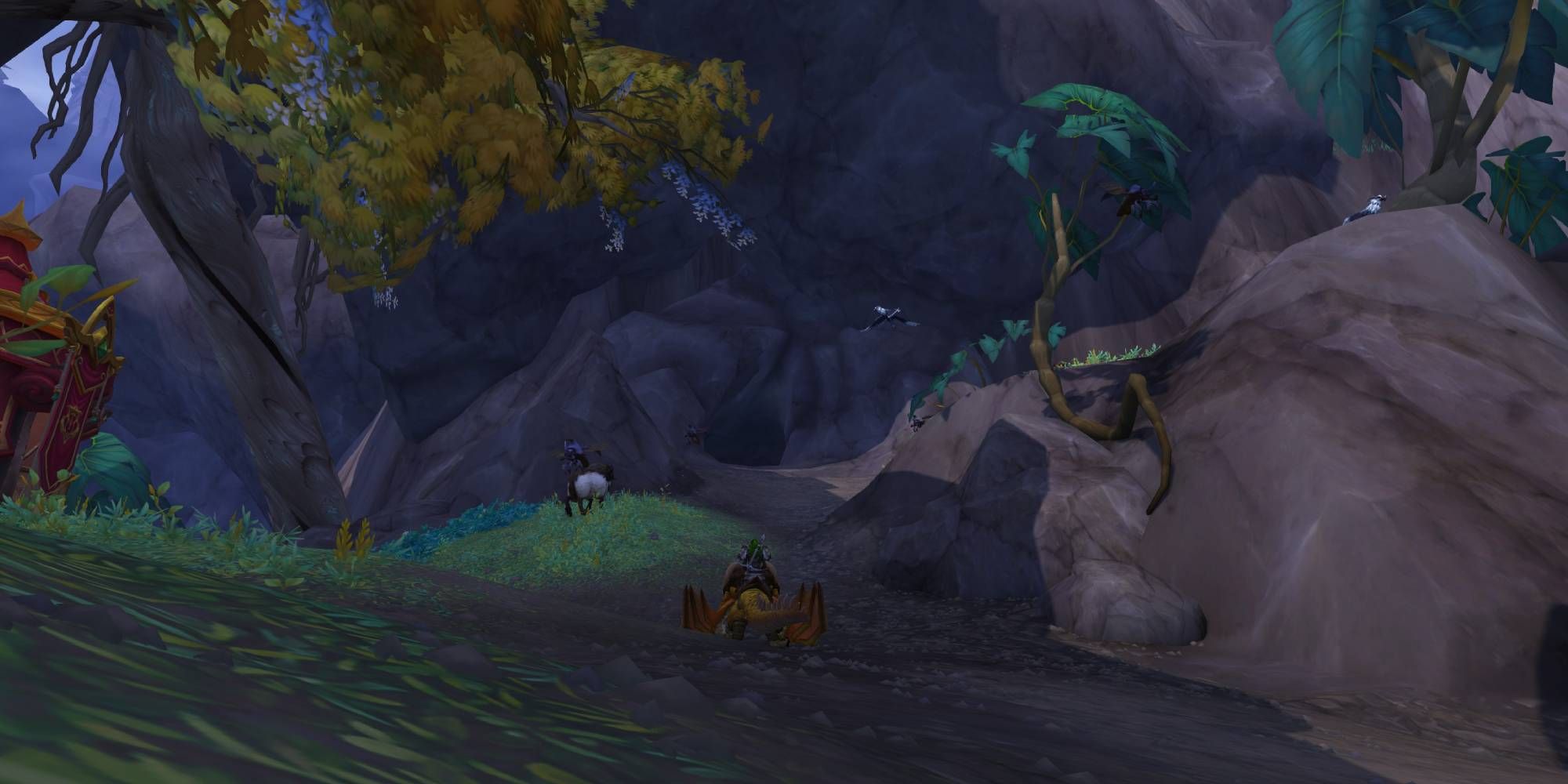WoW Dragonflight - an alternate view of the Forgotten Grotto entrance, with the player sitting on their dragonriding mount