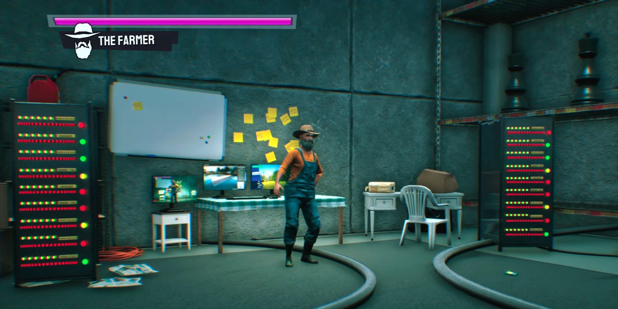 The Farmer stands in front of his monitors between his servers 