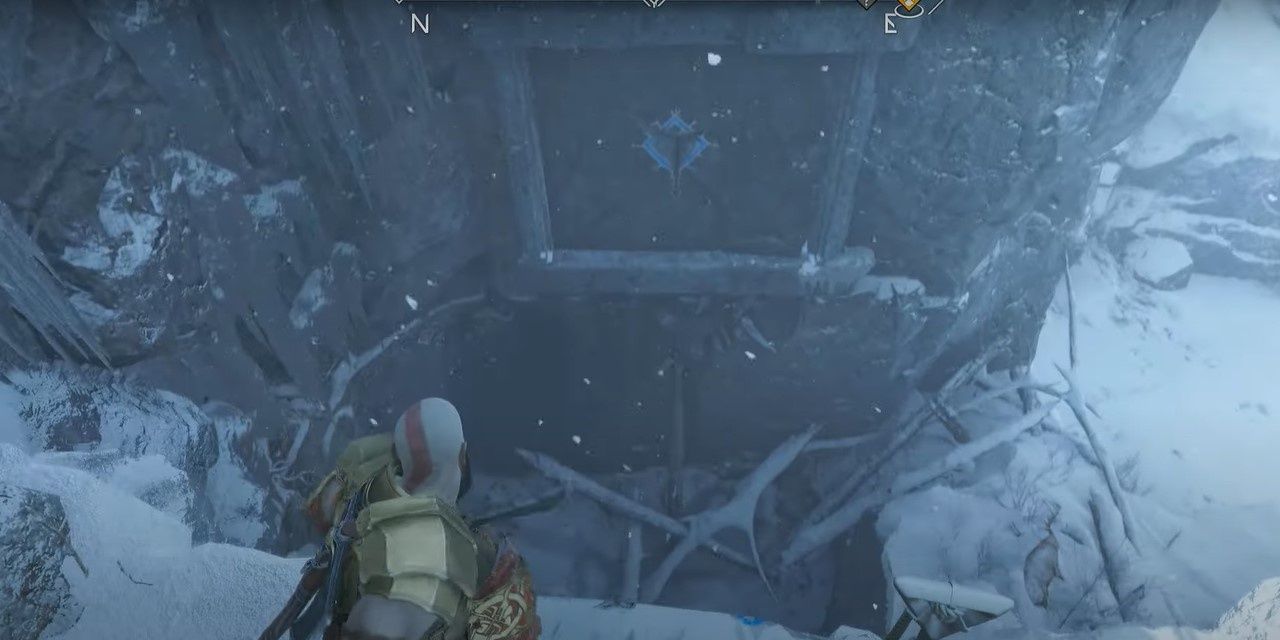 4 Kratos looking over a ledge in the Well of Urd