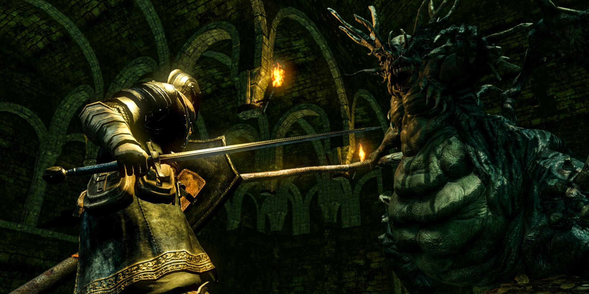 Chosen Undead facing off against creature in Dark Souls