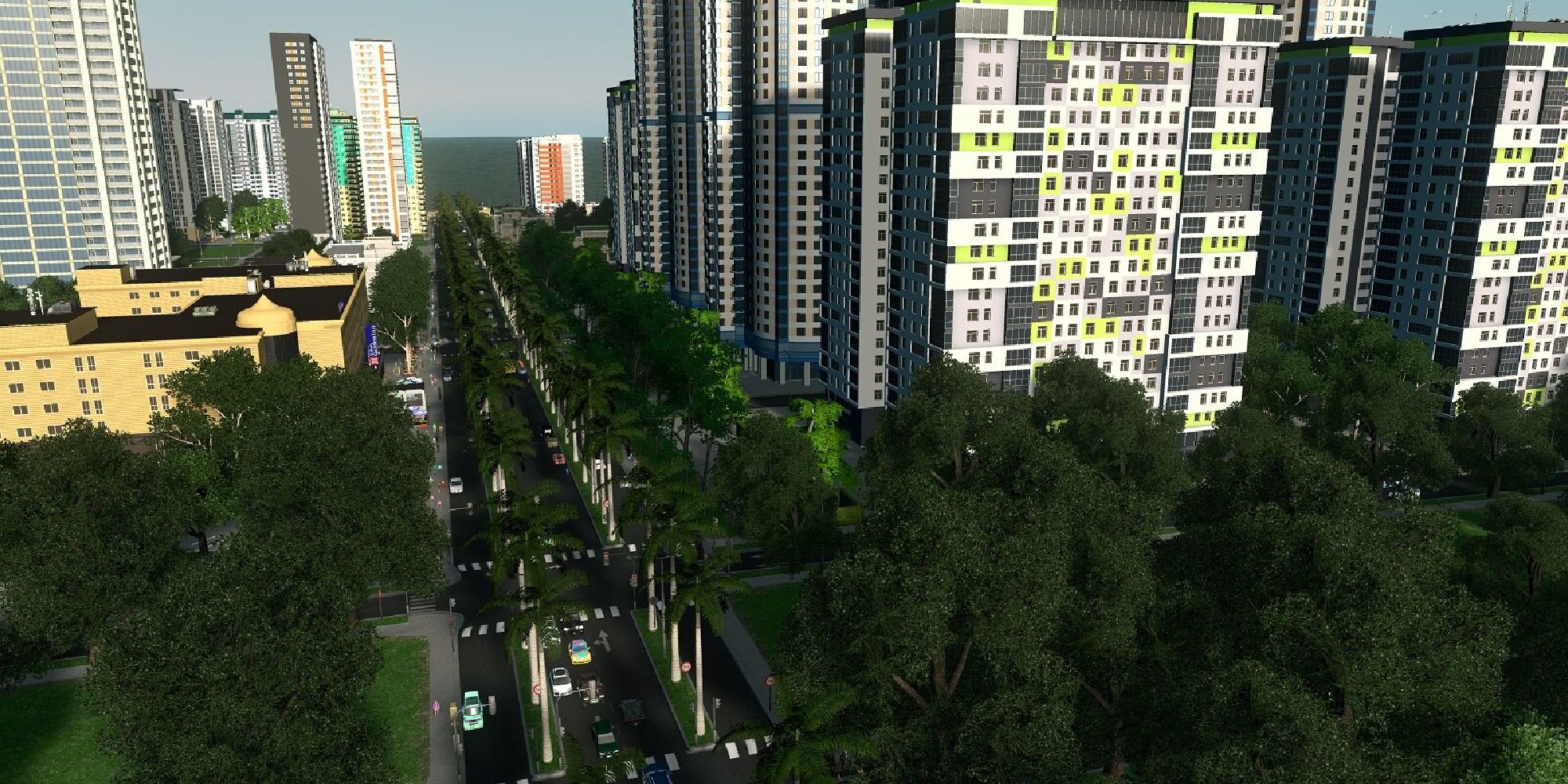 street lined with trees and tall buildings in background 