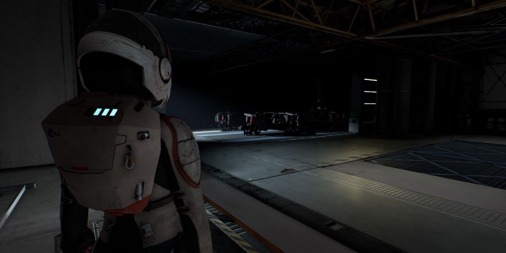 Kat scans rover parts in the garage of ARK Habitas