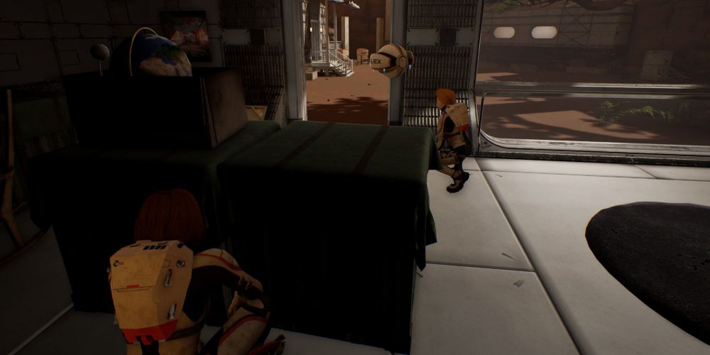 kat and sarah sneak through the unison colony