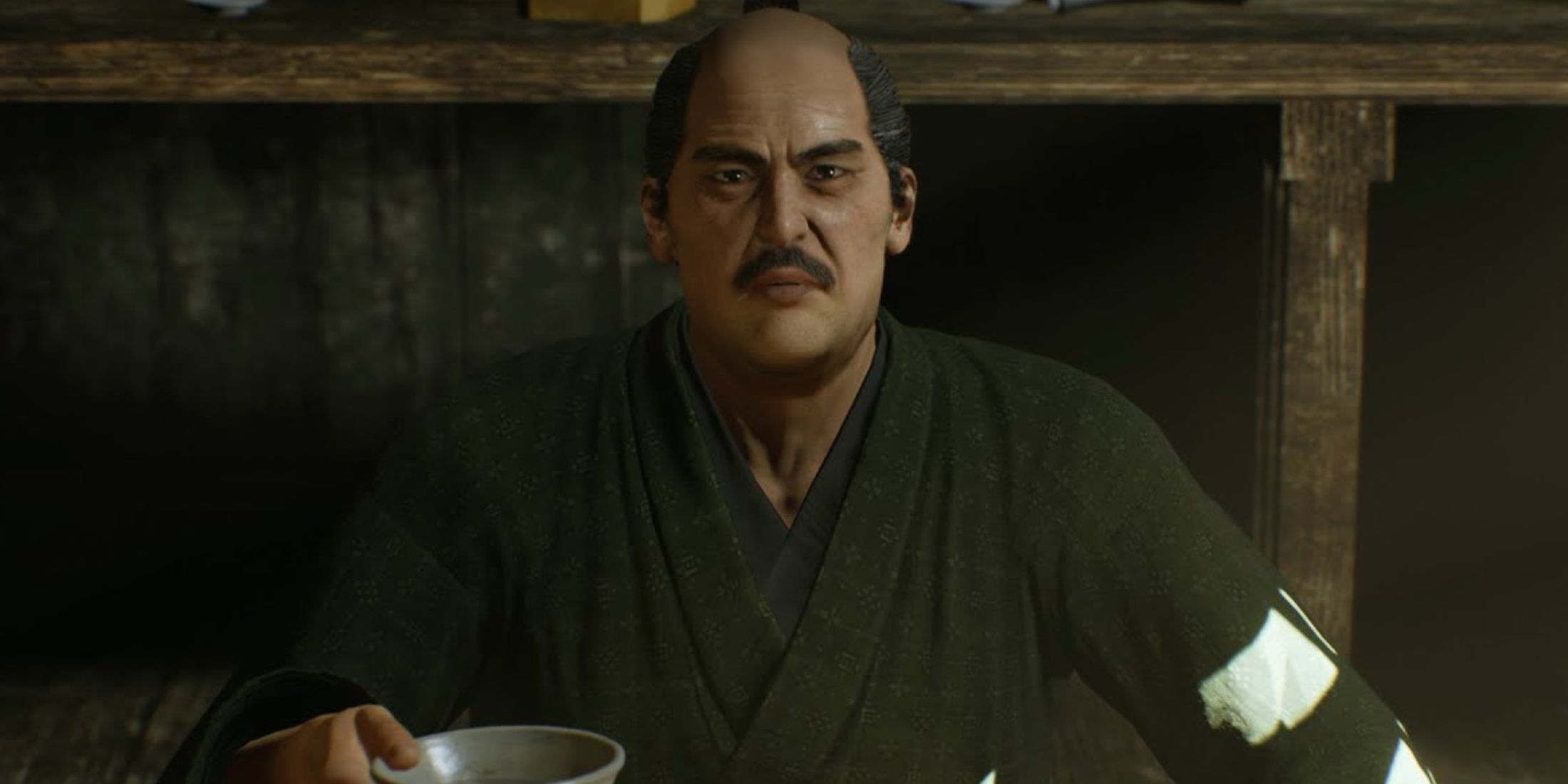 Yoshida Toyo about to sip some sake while talking to Ryoma Sakamoto in Like A Dragon: Ishin