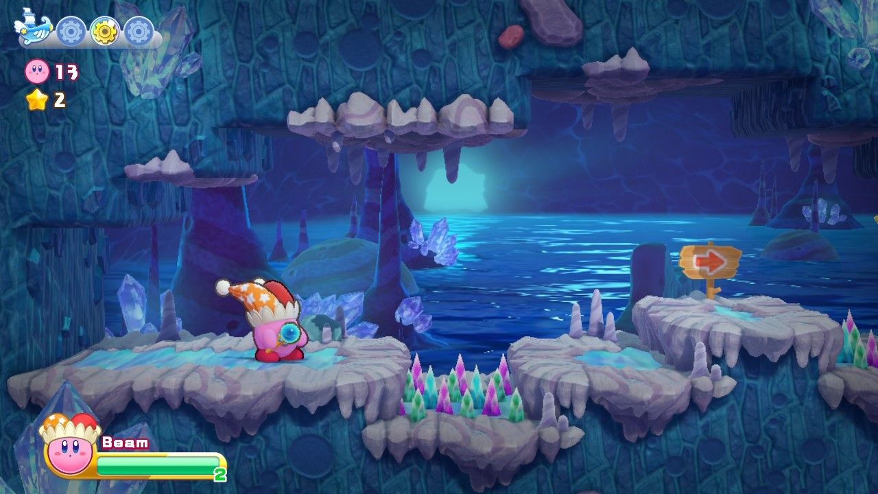 Kirby in front of a spiked floor.