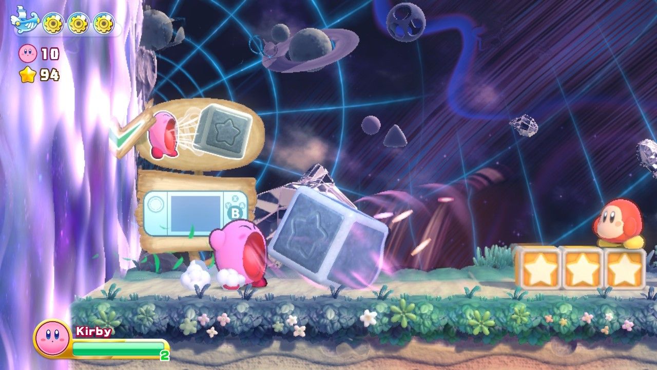 Kirby sucks in a big block as a wall follows him in Cookie Country in Kirby's Return to Dreamland Deluxe.