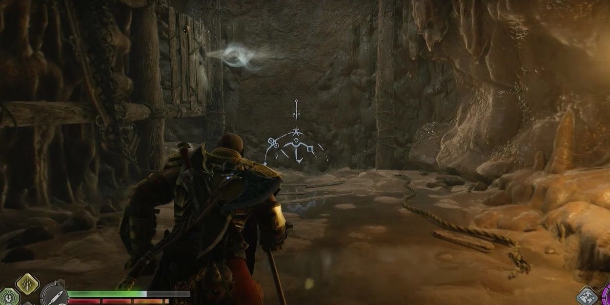 Kratos approaching a rock face with a spear indent to the left