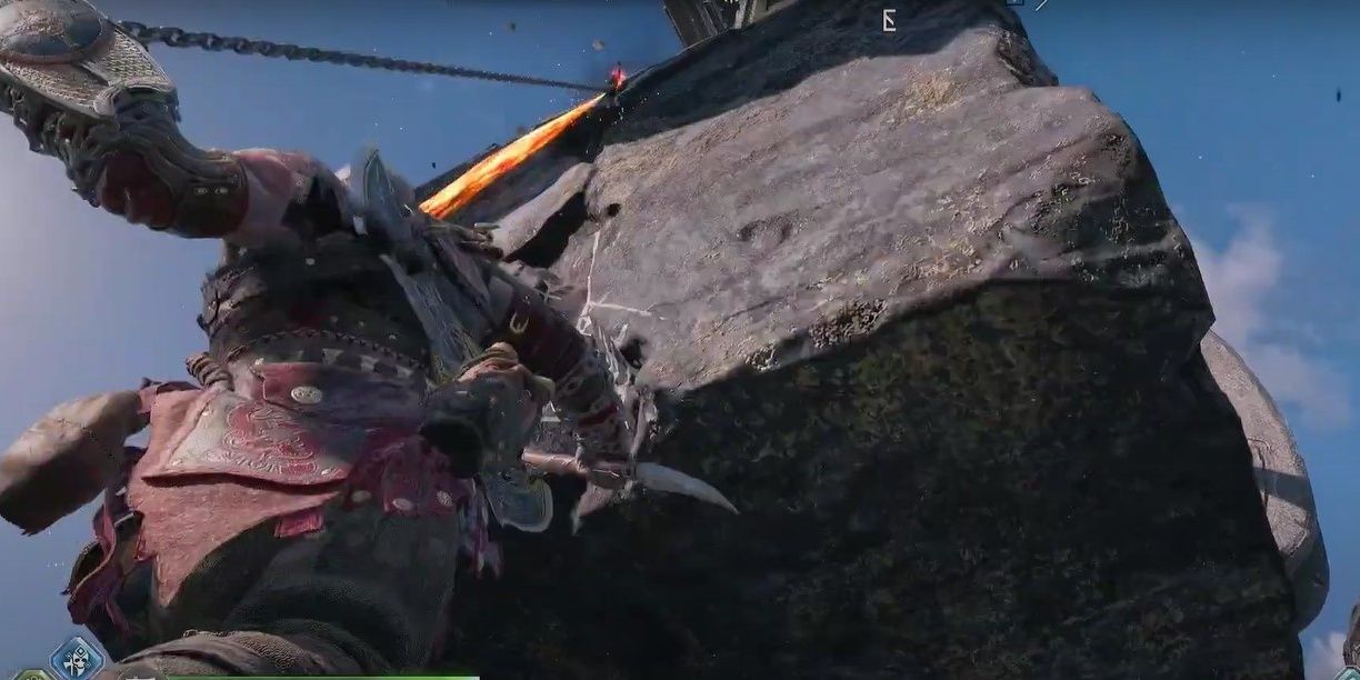 Kratos grappling up to a square stone