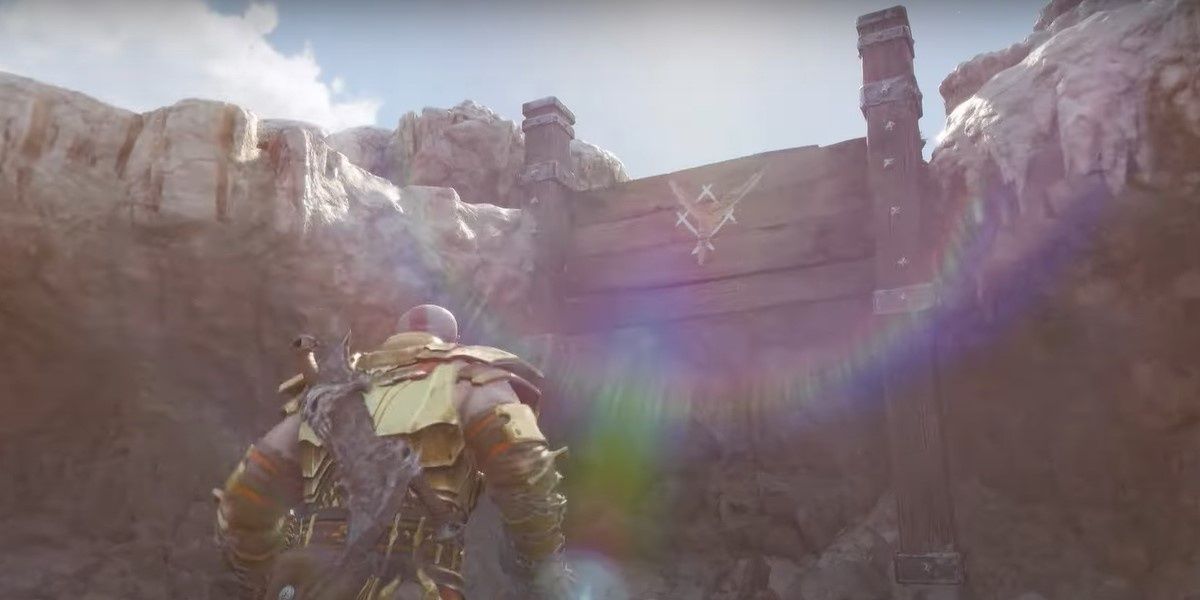 Kratos looking at a grapple point on rock ledge