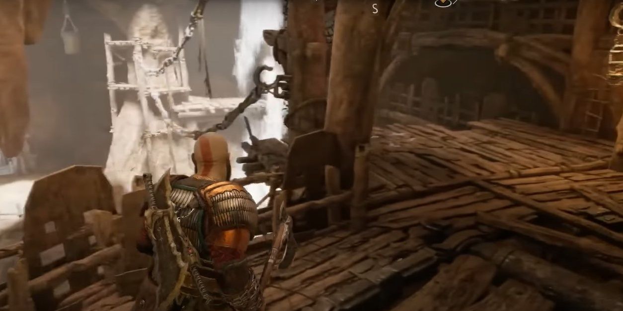 Kratos on wooden path with waterfall