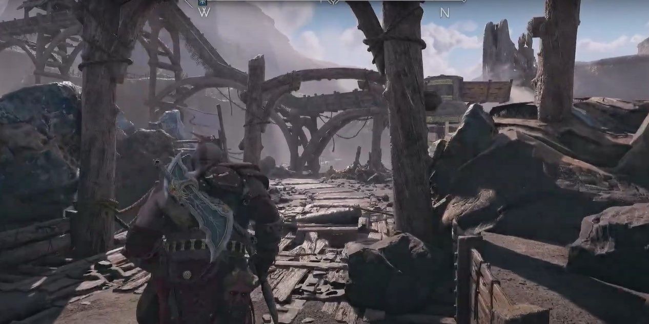 Kratos running toward broken wooden bridge in Jarnsmida Pitmines