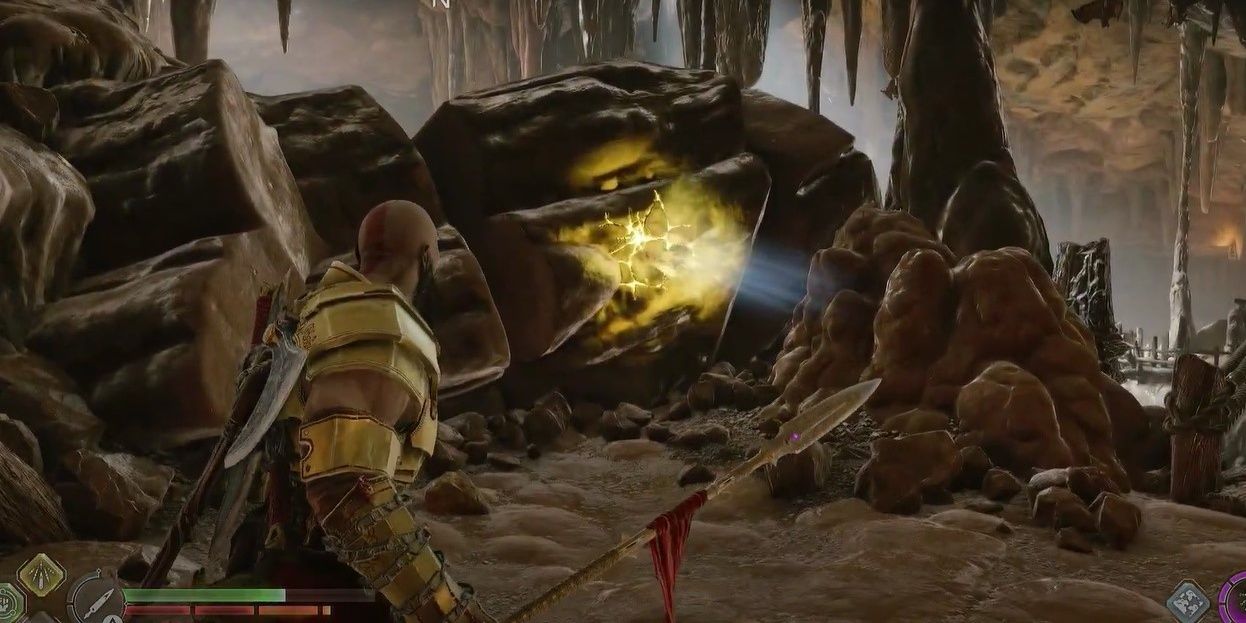 Kratos standing in front of an explodable boulder