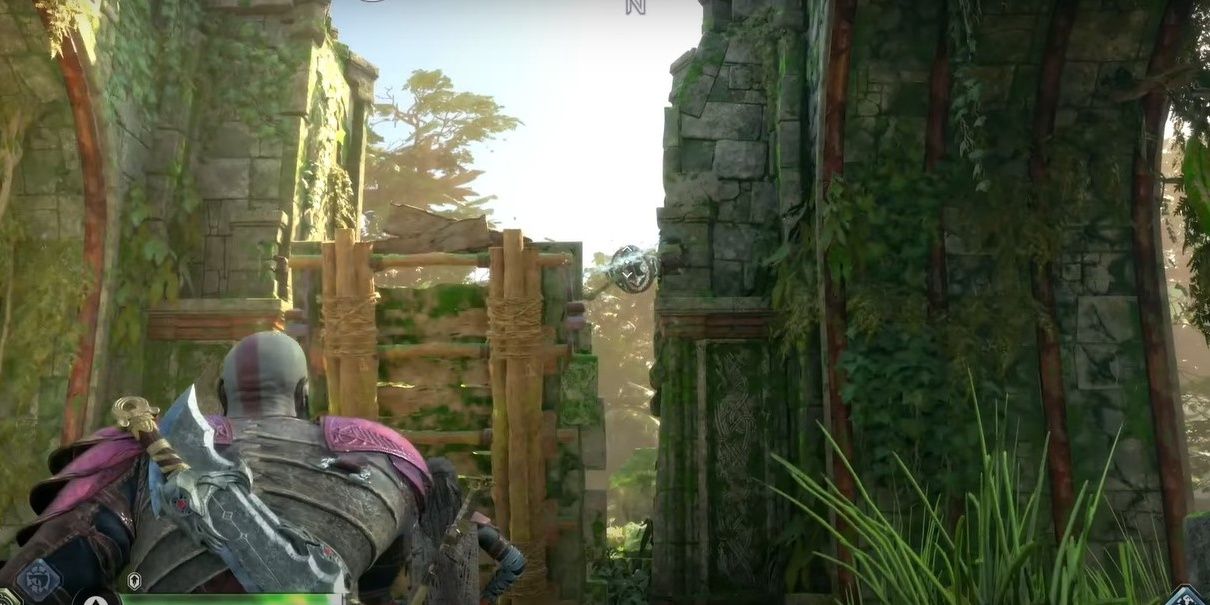Kratos throwing axe at clasp on right side of draw bridge