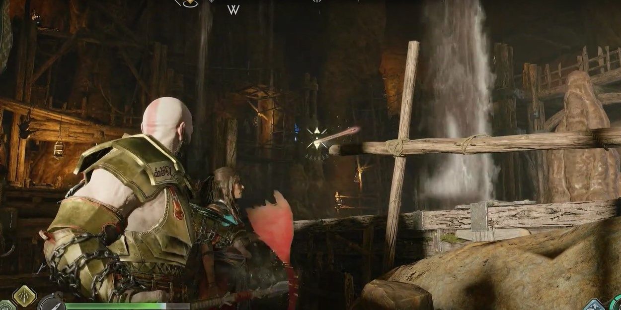 Kratos throwing spear at beam in underground