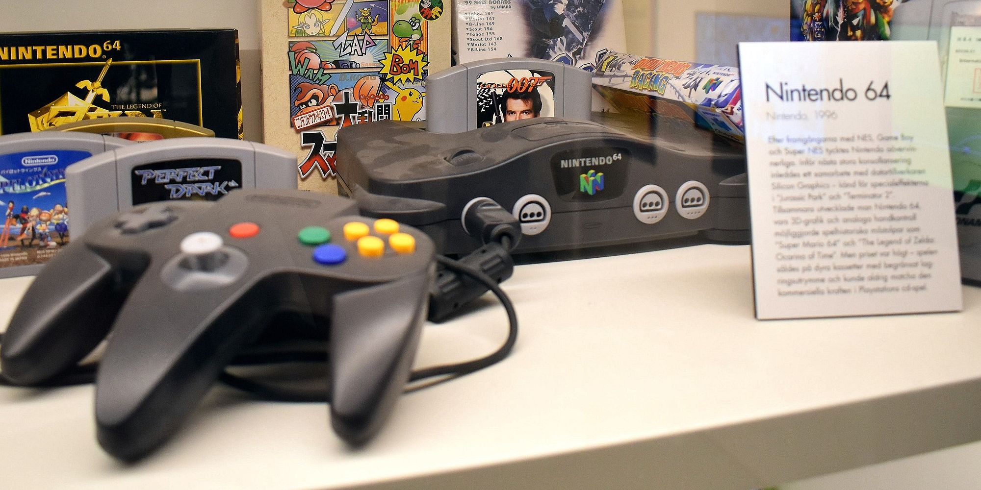 Nintendo 64 console and controller in a display case with Goldeneye visible
