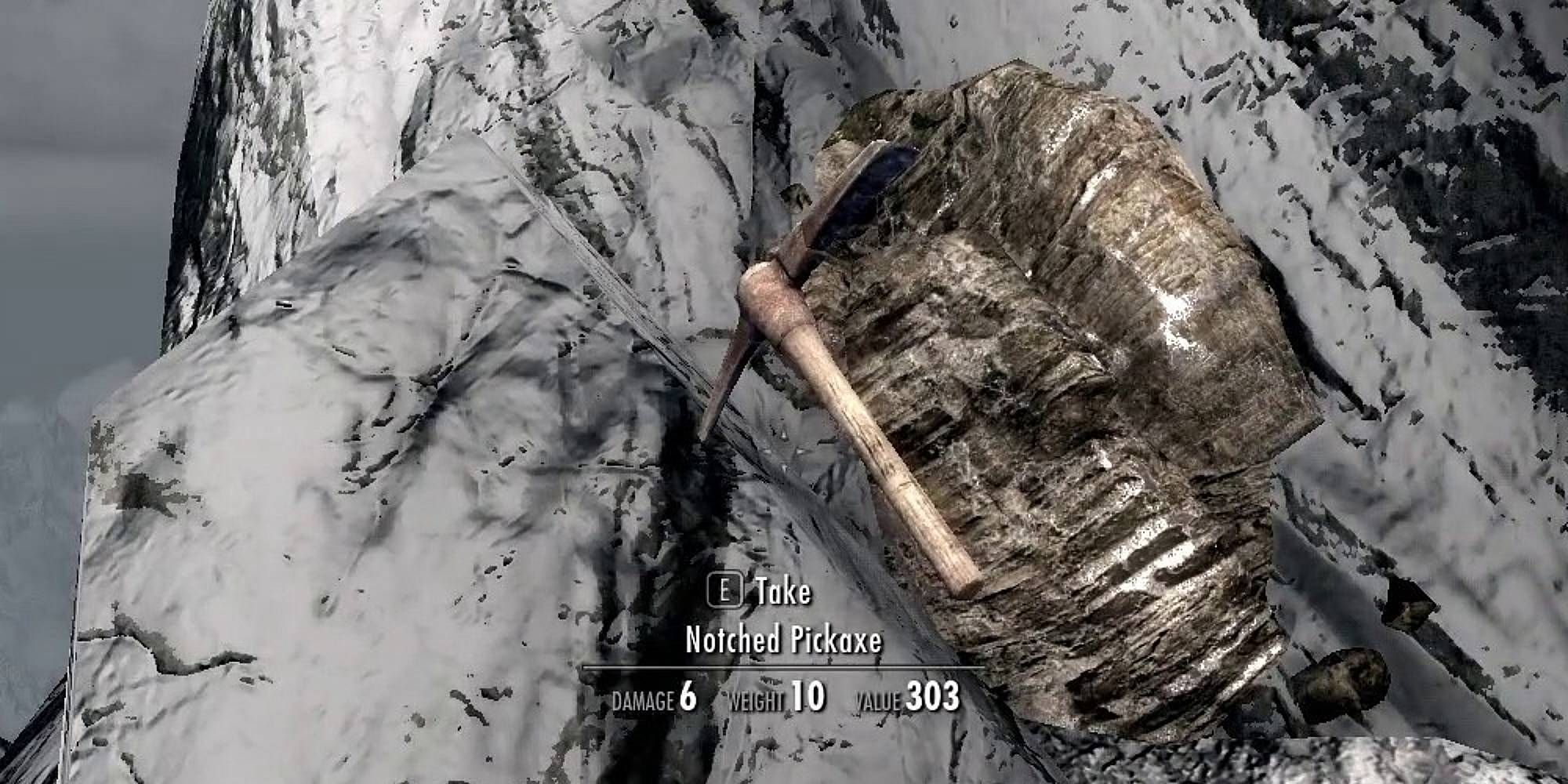 A pickaxe labelled Notched Pickaxe embedded into a mountain in Skyrim