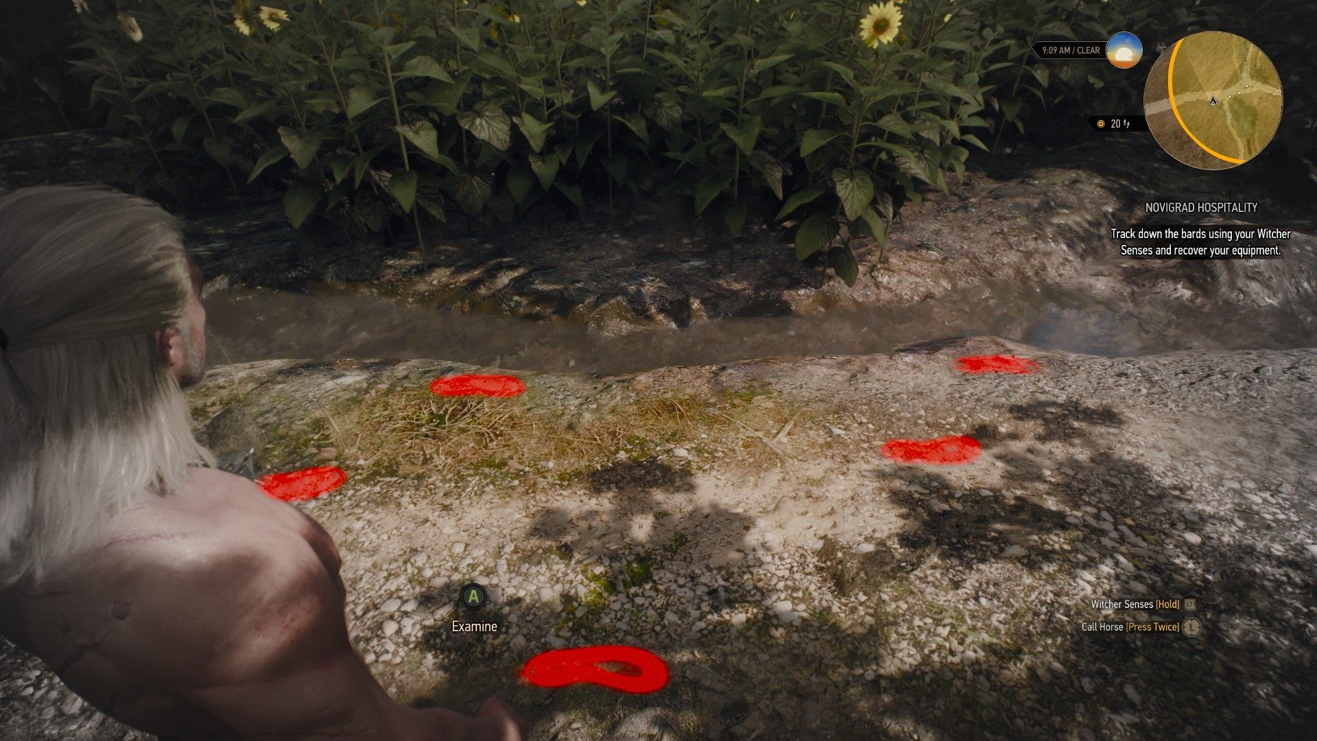 A screenshot showing Geralt's Witcher Senses highlighting a set of footprints on a dirt path in The Witcher 3.