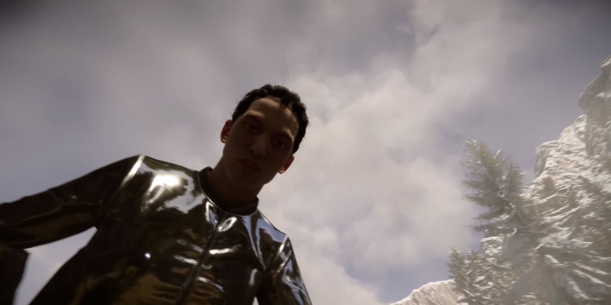 A man in a zipped up silver jacket looks down at the player before knocking them out
