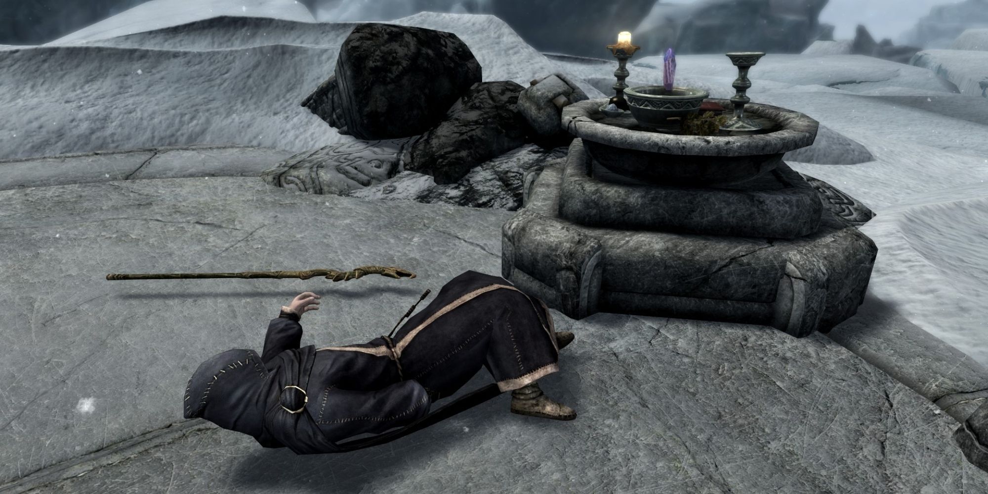 Rundi lies dead next to a staff by Rundi's Altar