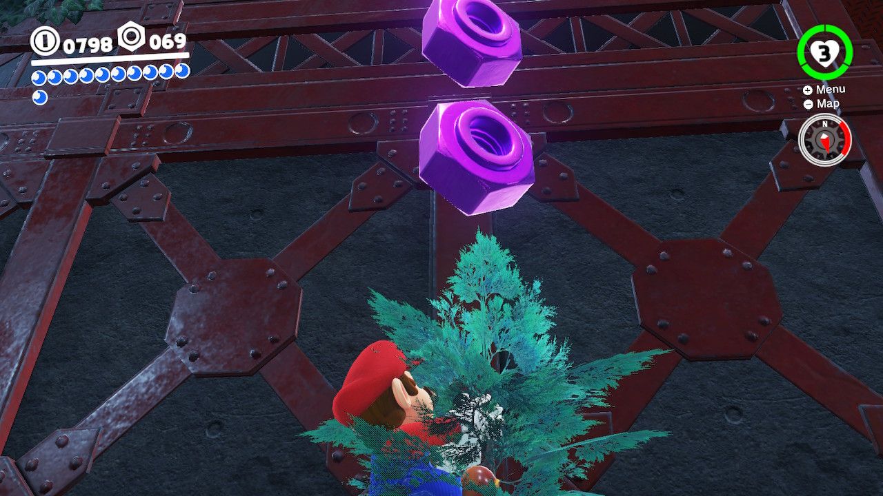 Mario climbs a tree with purple coins floating above him in the Wooded Kingdom in Super Mario Odyssey.