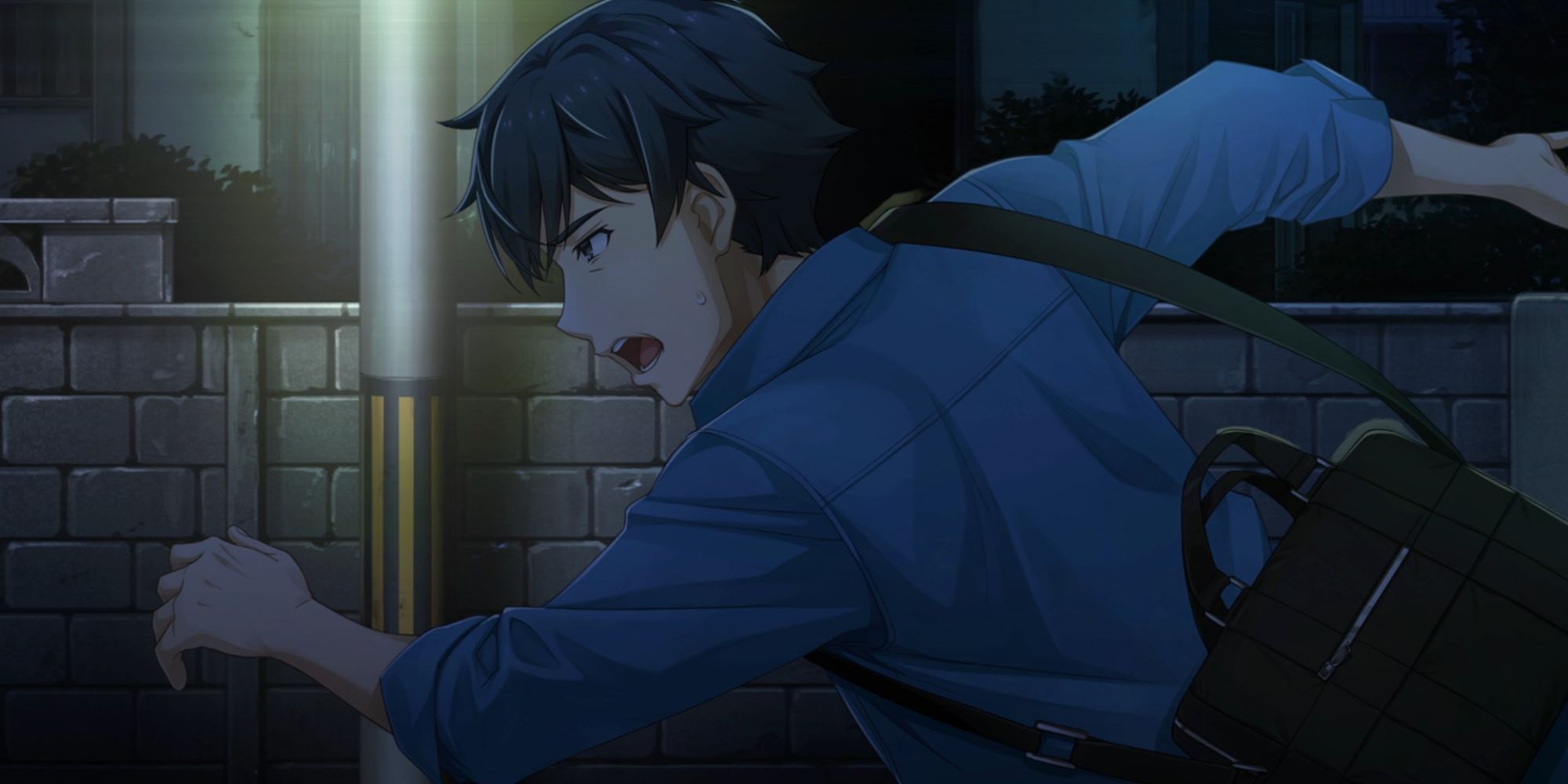 Taro runs down the street at night