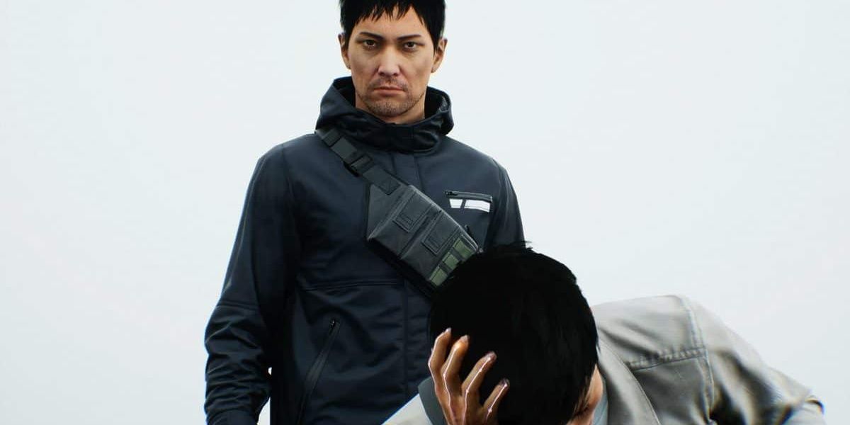 KK standing over Akito