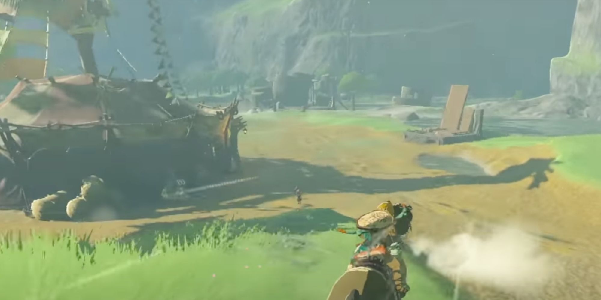Link On Horseback Riding Past A Stable In Hyrule Field