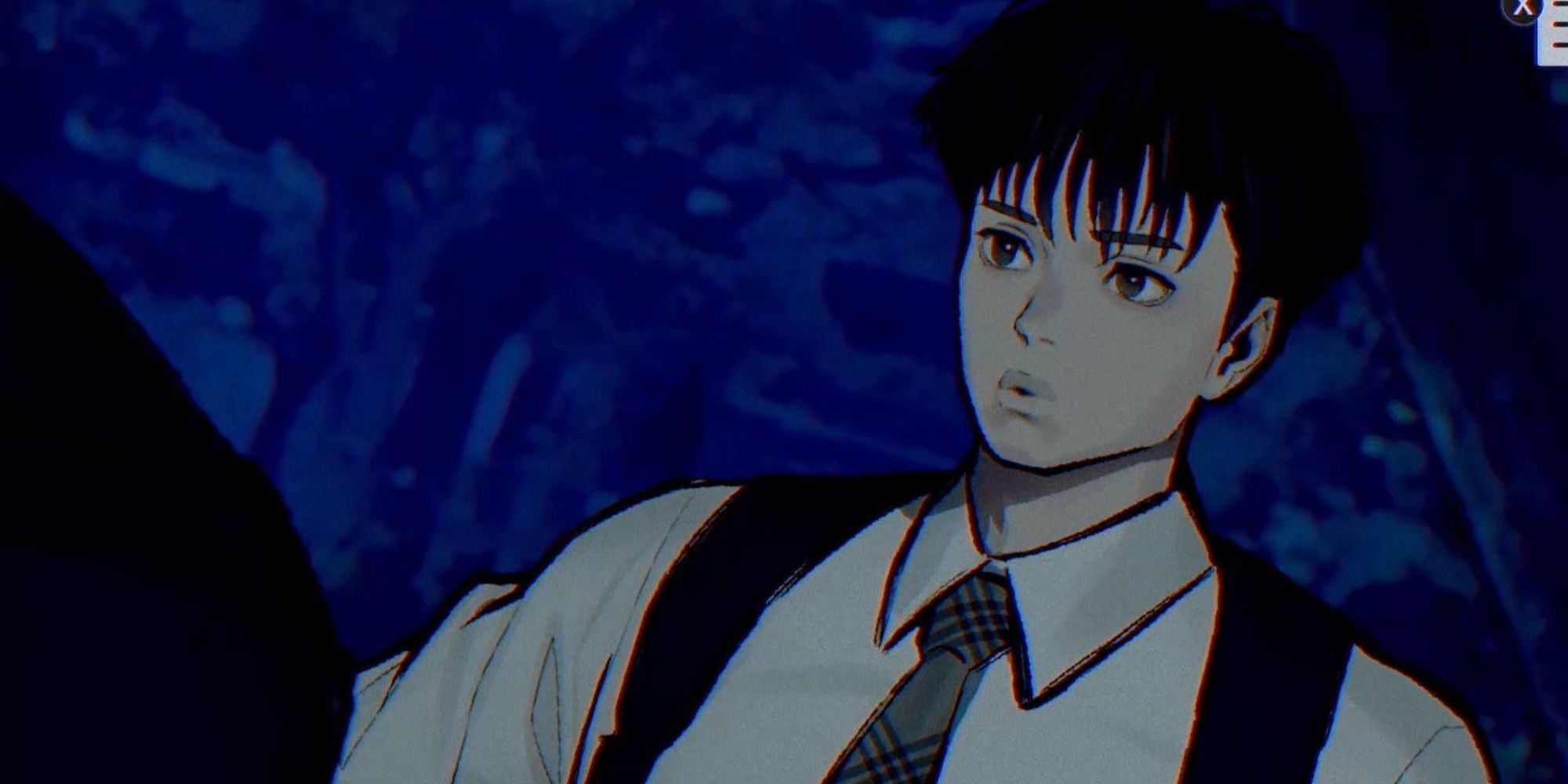 Jun Erio stands outside in a park at night