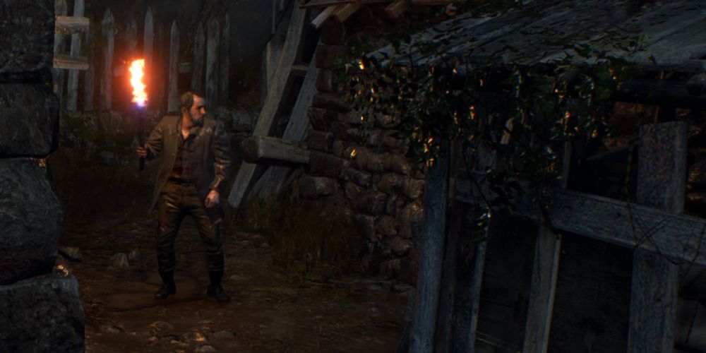 a lone ganado with a torch in resident evil 4 remake