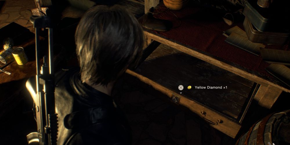 leon kennedy finds a yellow diamond inside a locked drawer in the church storeroom in resident evil 4 remake