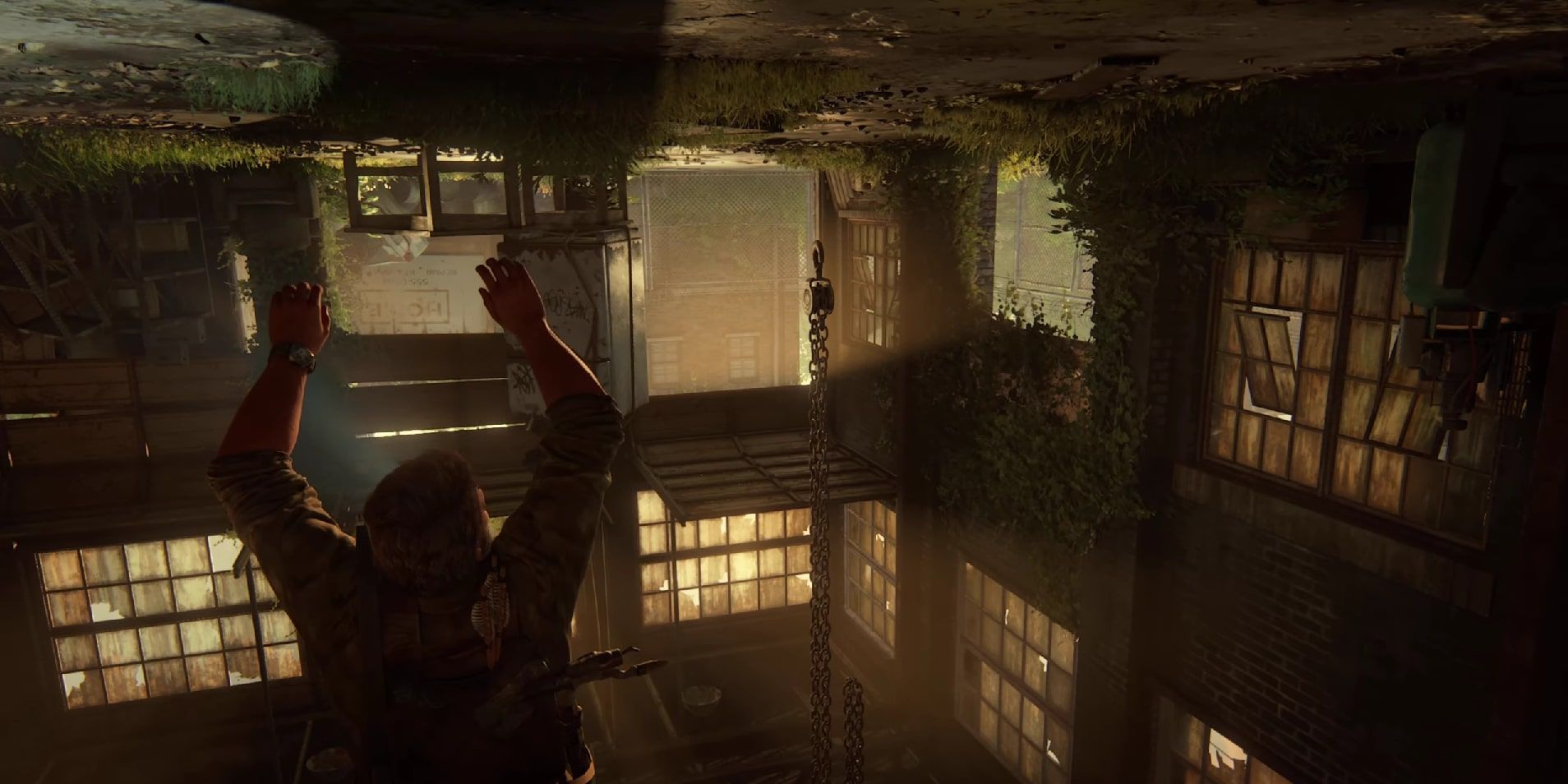 Joel caught in Bill's refrigerator trap, his foot entangled in a chain, as Ellie will try to help him down.