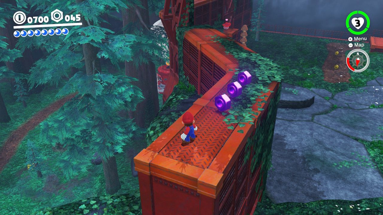 Mario on a metal platform next to some purple coins in the Wooded Kingdom in Super Mario Odyssey.